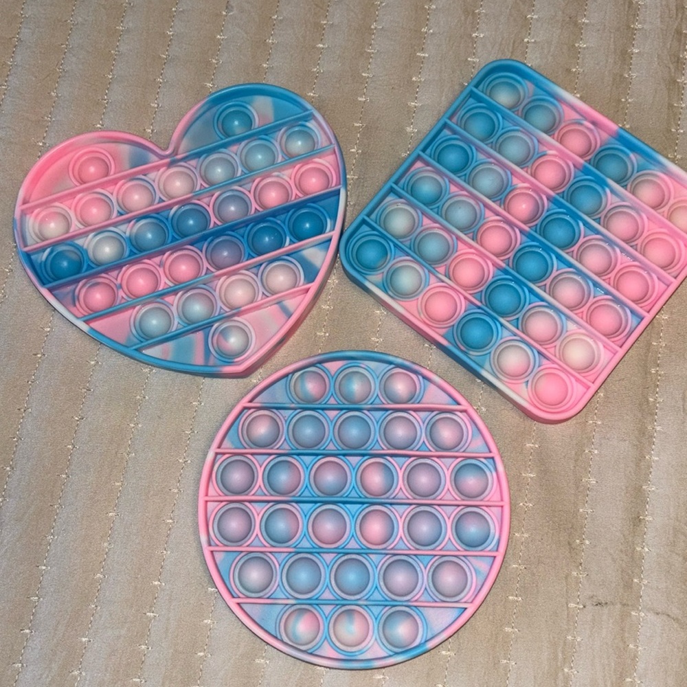 Brand new fidget popper toys pink and blue 3 piece set